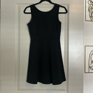 Short, open back black dress size s